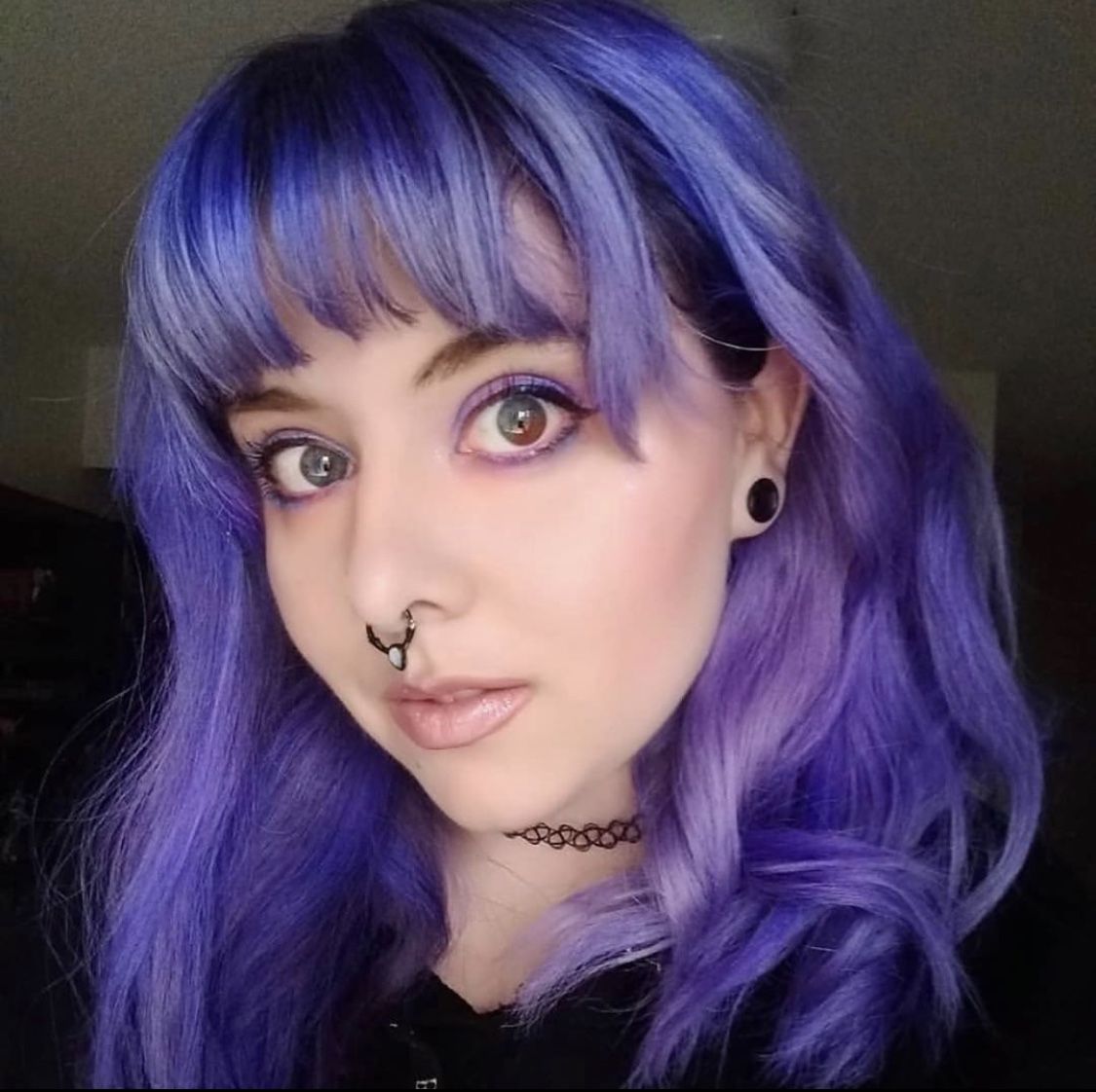 Woman with deep purple hair and fringe, styled with Punky Colour Purpledacious for a bold, vibrant look.