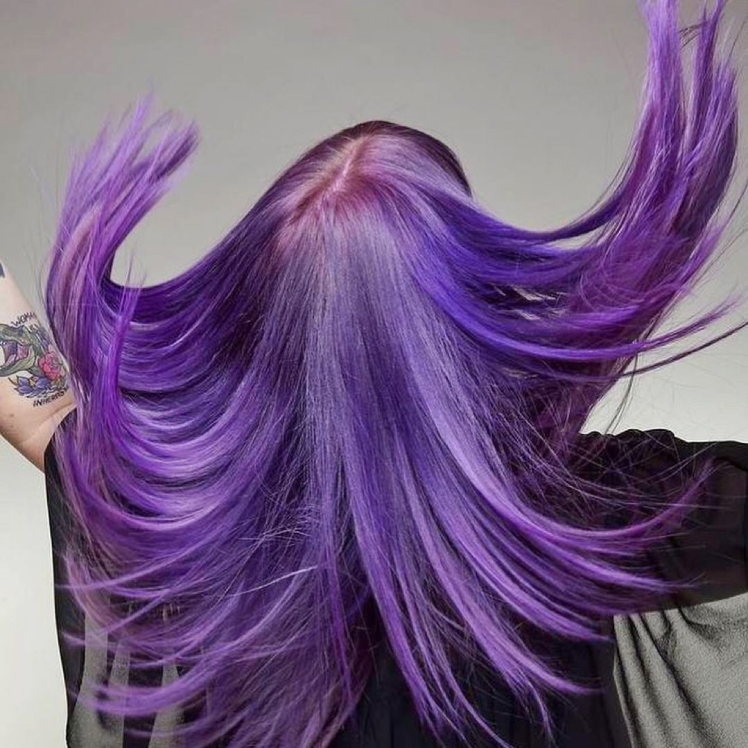 Back view of long, flowing purple hair dyed with Punky Colour Purpledacious, showcasing shine and intensity.