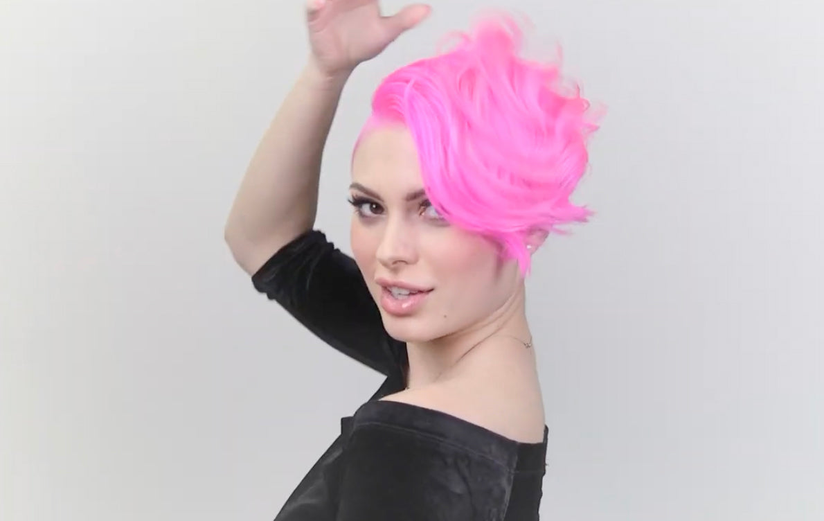 Woman Holding Colour Off Remover – Influencer with pastel pink and black hair holding Punky Colour Off hair remover kit.