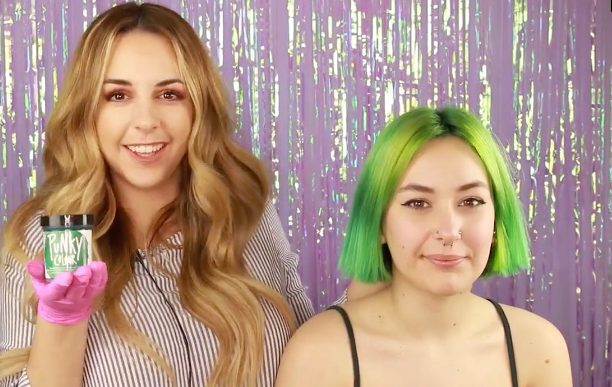 Stylist Applying Green Hair Dye – Hairstylist in gloves holding Punky Colour green dye while coloring client’s hair vibrant lime green.
