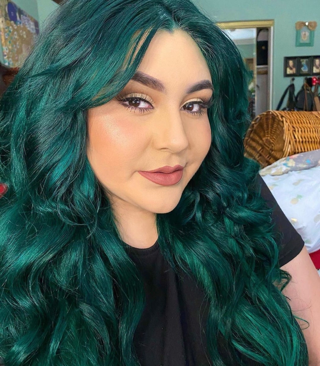 Woman with Deep Green Hair - Model with voluminous, wavy green hair dyed with Punky Colour Alpine Green for a bold, vibrant look.