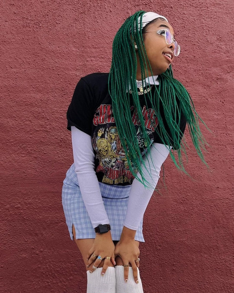 Braided Green Hair Look - Stylish individual with long, braided green hair, showcasing the vibrancy of Punky Colour Alpine Green dye.