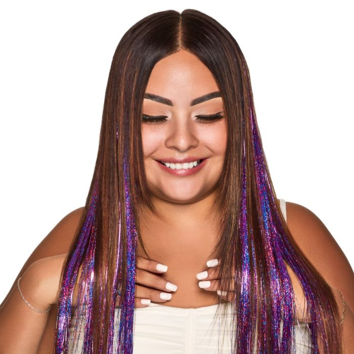 Woman with Punky Colour Mane Hair Tinsel in Purple - Model with long brown hair wearing vibrant purple clip-in hair tinsel strands.