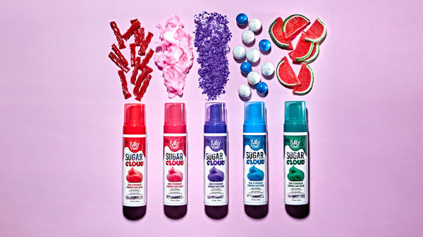 An aerial shot of the Punky Colour Sugar Cloud Hair Color Collection with candy spilling out of each bottle