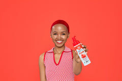 Model with red hair holding up a foam spray can of  Punky Colour Sugar Cloud Licorice Semi Permanent Foam Color
