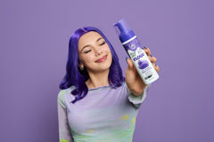 Model with colored hair holding up a spray can of  Punky Colour Sugar Cloud  Pop Rock Semi Permanent Foam Color